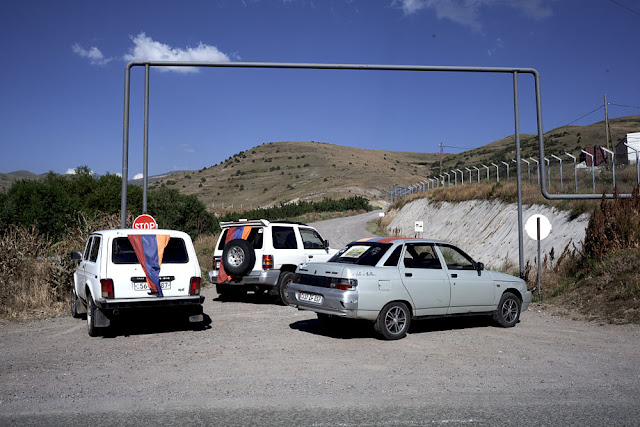 Image Attribute: Cars draped in Armenian flags at Blockade Number Three / Photo: Klaus Richter