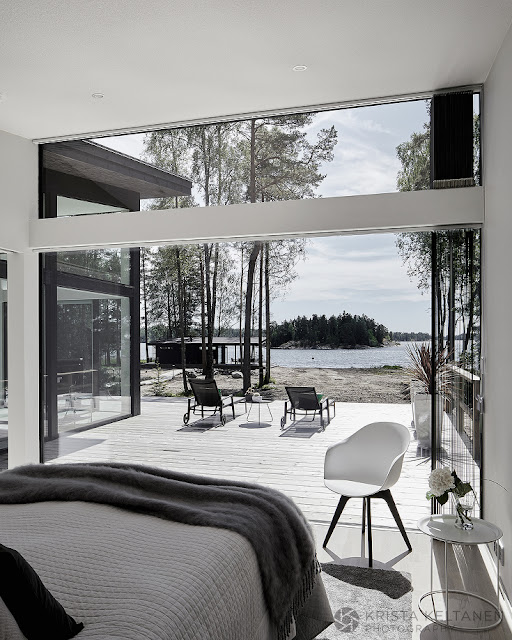 A modern glass walled house in Finland by Krista Keltanen Photography