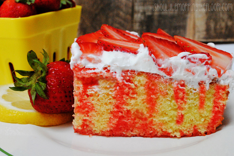 Strawberry Lemonade Jell-o Poke Cake: the perfect summer dessert. Uses an easy box mix as the base...with lots of yummy flavors incorporated.