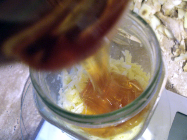 pour honey over grated fresh ginger