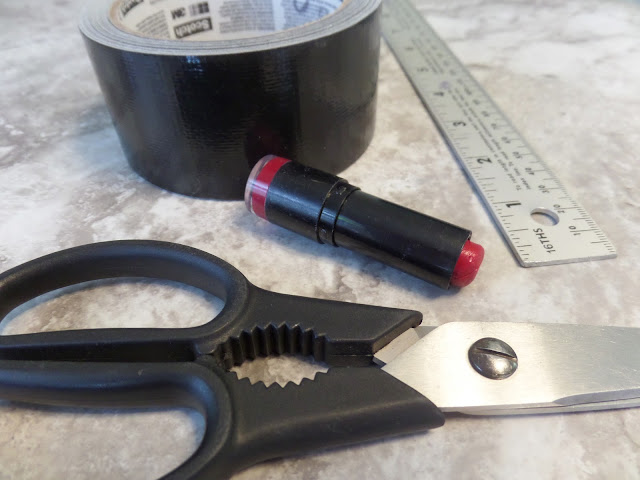 yard stick duct tape scissors lipstick