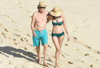 In an aqua trunks, Paul McCartney, 73, accompanied his beautiful 5 years lover, Nancy Shevell, 56, for walking in a green bikini as The couple seemed very enjoy the St Barts situation of beach on Sunday afternoon, December 27, 2015.