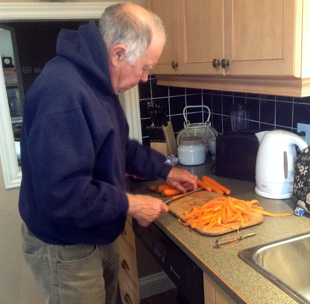 Our Healthy Eating Journey: Hubby chopping carrots man chopping carrots