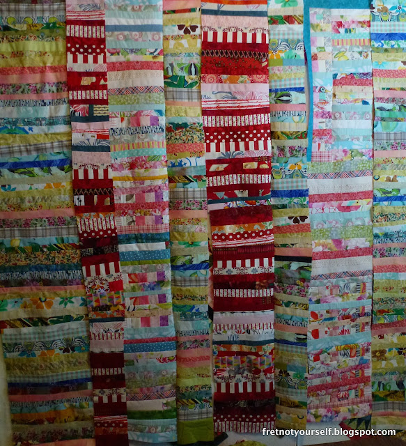 Improv quilt made from columns of strings. Chinese Coins