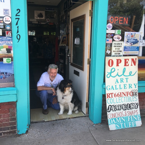 Bob "Crocodile" Lile and dog Lady in doorway of Lile Art Gallery on Route 66 Historic District in Amarillo, Texas Bob "Crocodile" Lile and dog Lady in doorway of Lile Art Gallery on Route 66 Historic District in Amarillo, Texas