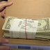 Woman finds 5000 dollars inside her pack of Chicken wings she ordered from Domino's