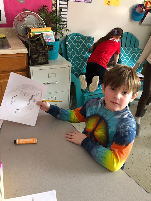 kid showing drawing