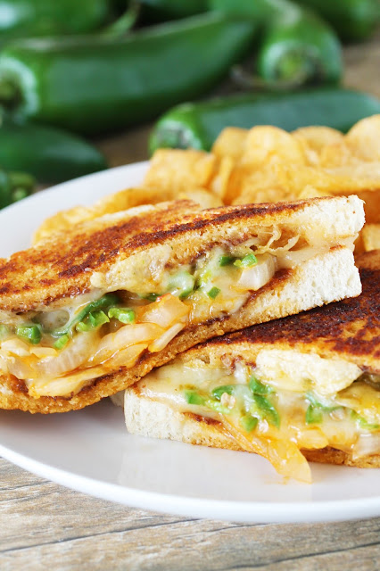 Burn your face off with flavor with the ultimate spicy grilled cheese sandwich with jalapenos, sriracha, and pepperjack cheese.