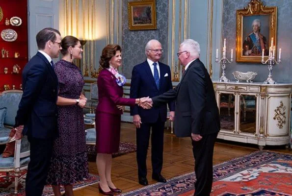 Crown Princess Victoria wore By Malina Lysandra dress. Queen Silvia wore burgundy satin suit