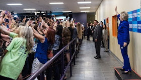 Hilary Clinton with crowd taking selfies