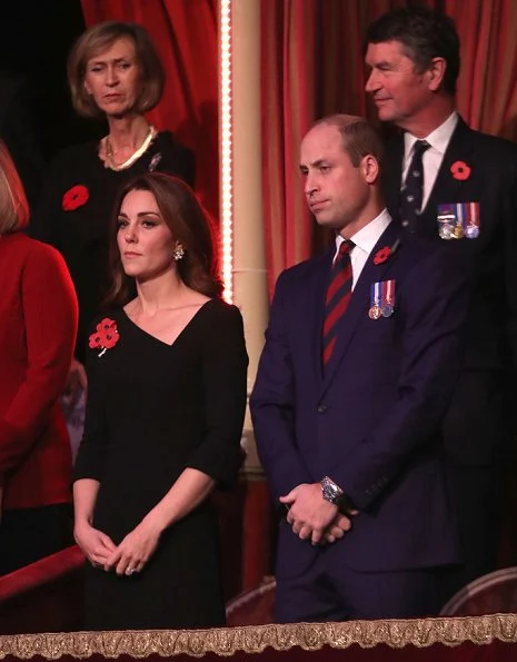 Kate Middleton wore Roland Mouret asymmetric neck dress. Meghan Markle wore Stella McCartney tie detail coat