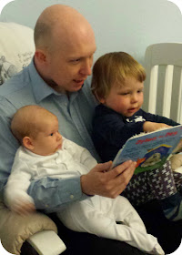 daddy reading to boys, father and sons, father reading to children