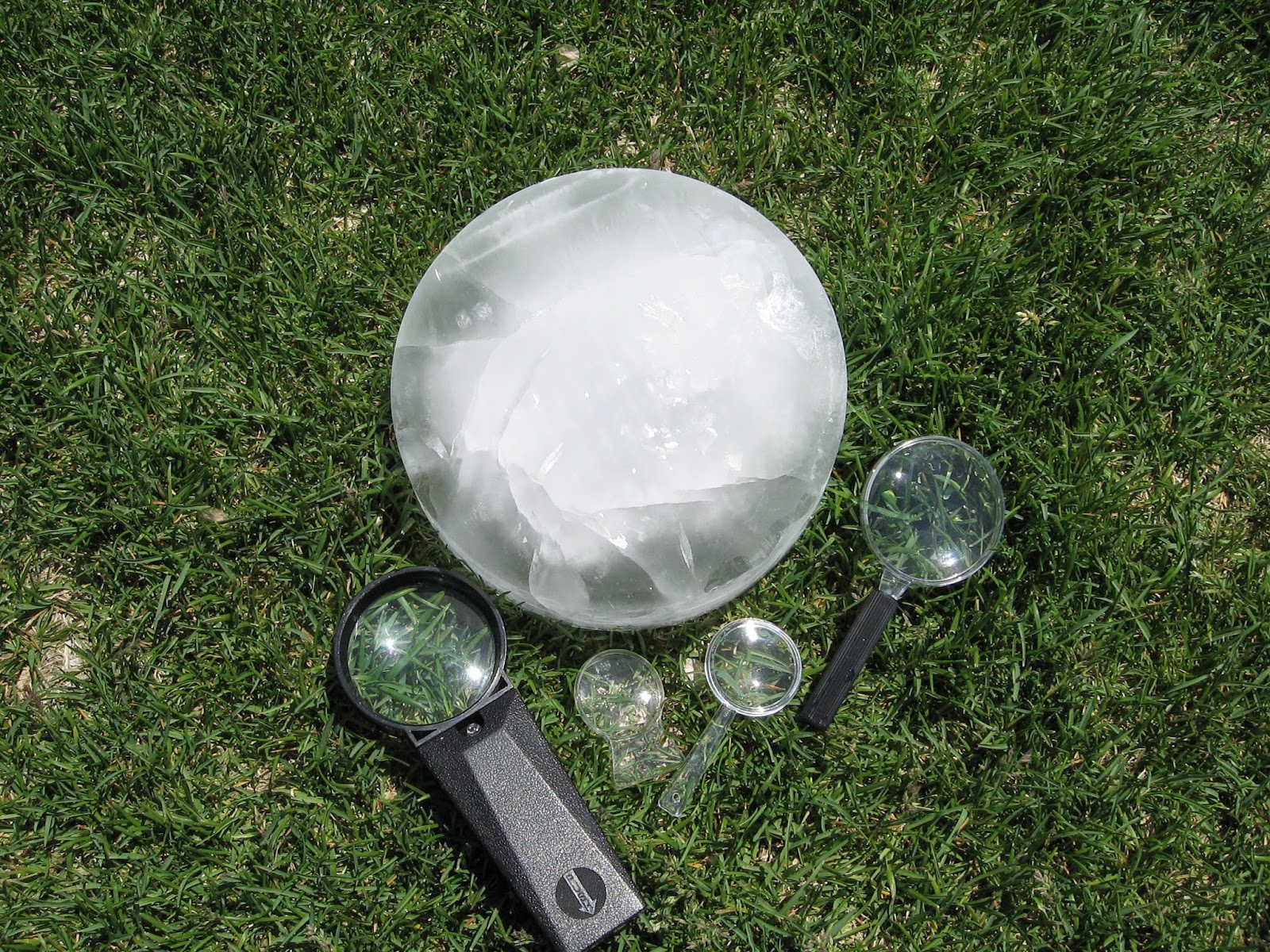 Almost Unschoolers: Summer Fun 2014 - Melting Ice With a Magnifying Glass