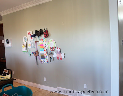 Wall with kids' artwork hanging, from Fun Cheap or Free