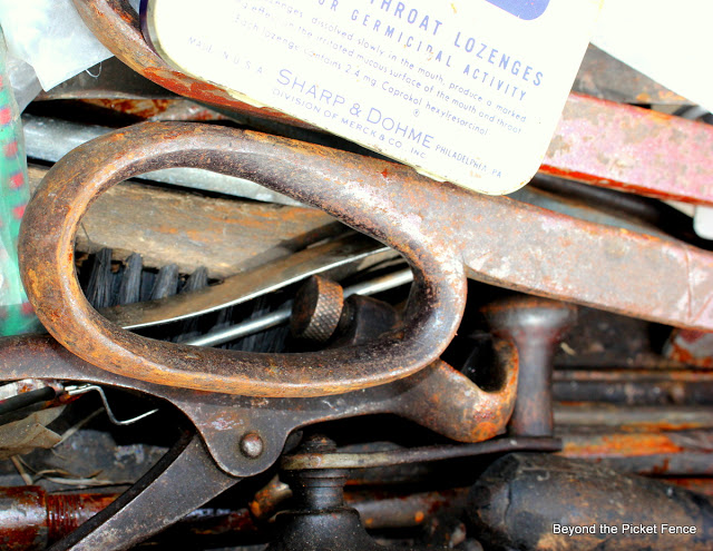 rusty junk in an old metal toolbox