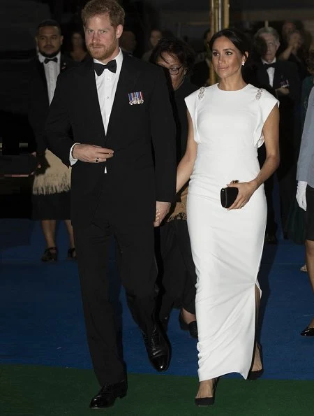 Meghan Markle wore THEIA ivory cap sleeve beaded shoulder gown, Birks snowflake snowstorm diamond earrings and carried Givenchy satin clutch