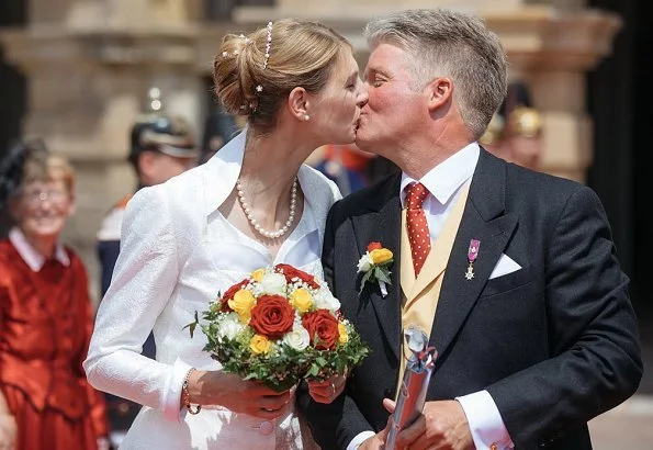 Princess Stephanie of Saxe-Coburg and Gotha wore a white silk wedding dress from German fashion designer Gordon Sieverding, who is based in Michelau