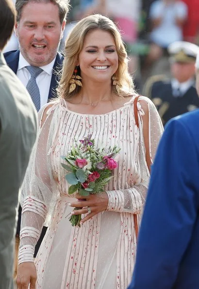 Princess Madeleine wore RED Valentino Natural Pleated Tulle Floral Print Midi Dress and Princess Sofia wore & Other Stories Tie Frill Dress. Princess Estelle