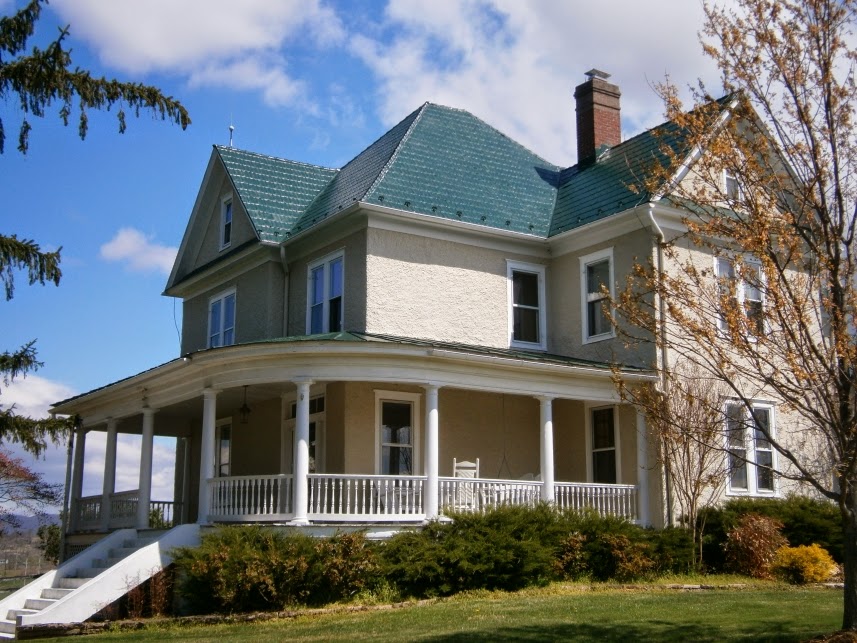On a hilltop near Flint Hill, VA, a stately home restored their green metal shingles
