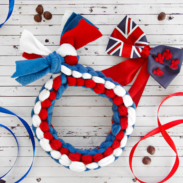 DIY Olympic-Inspired Dog Tug Toy Ideas Red white and blue woven fleece dog tug toy and New Zealand flag bow tie