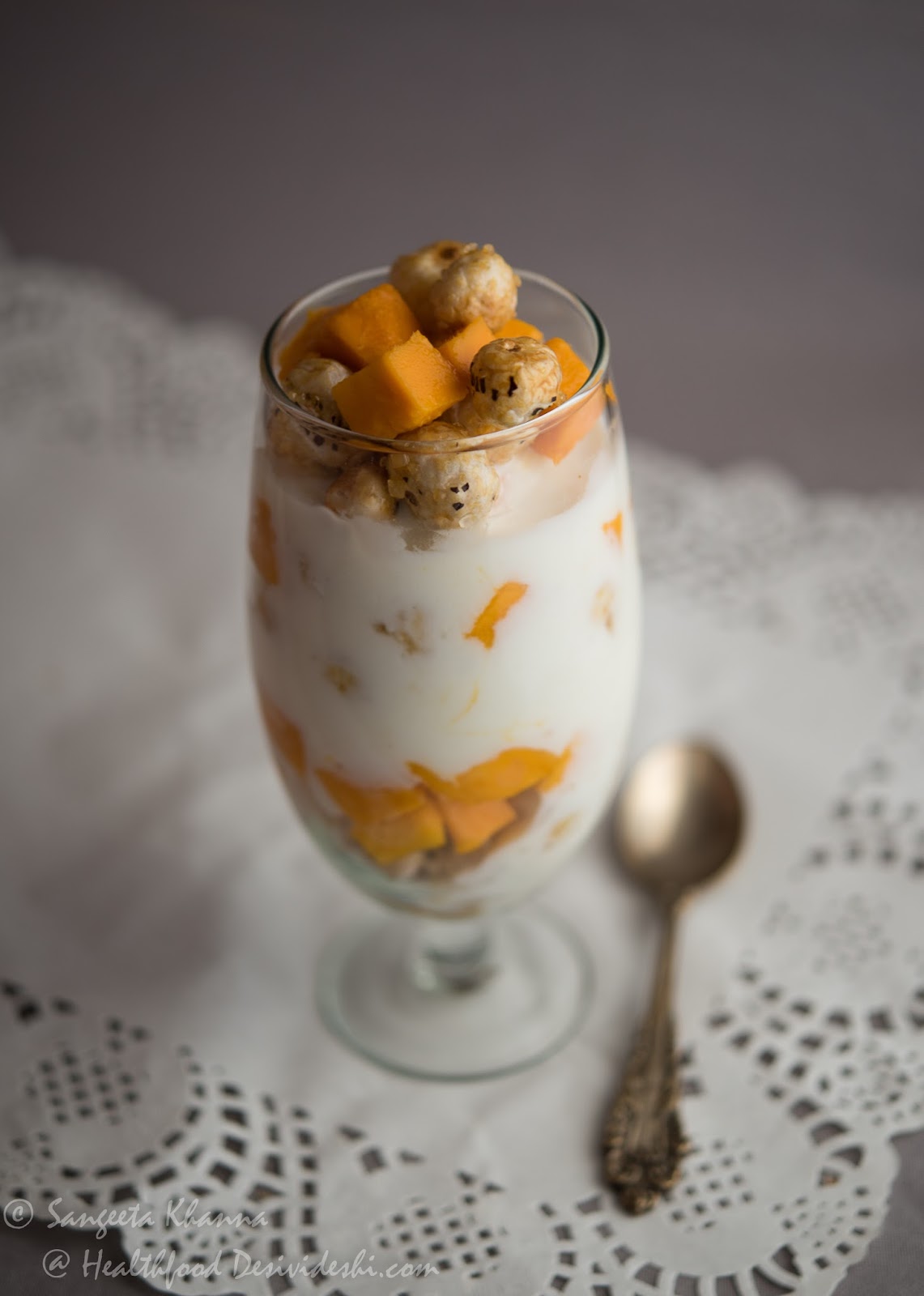 a healthy parfait made from scratch caramelisd Fox nuts and Mango