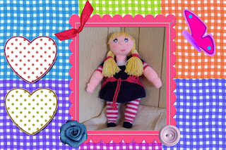 big blue eyes, blonde yarn fishtail braids, circular removable vest craftybegonia doll dolly abby cute yarn friend