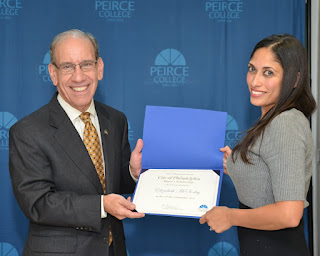 Elizabeth McSorley receiving her scholarship for college