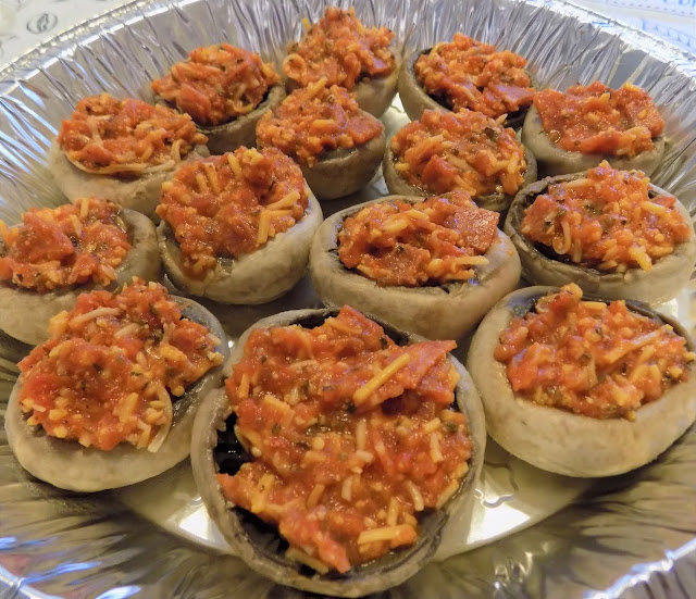 This is a picture of mushrooms stuffed with pizza sauce, pepperoni and cheese and spices