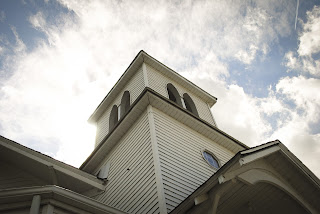 Church steeple against clouds