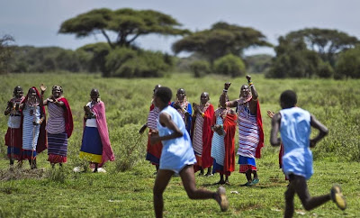 Cheering on the athletics  Maasai Olympics 2014 Kenya