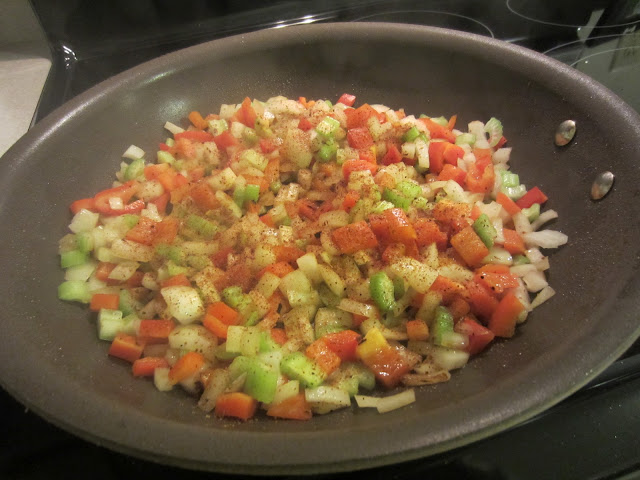 Easy One Pan Chicken and Sausage Jambalaya vegetables sauteing in pan