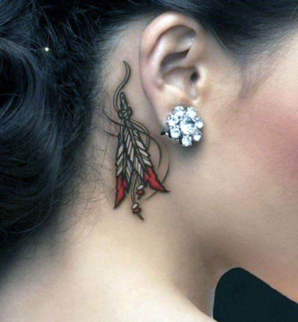 Girl’s behind the ear looks so nice with this native american feather colorful tattoo design