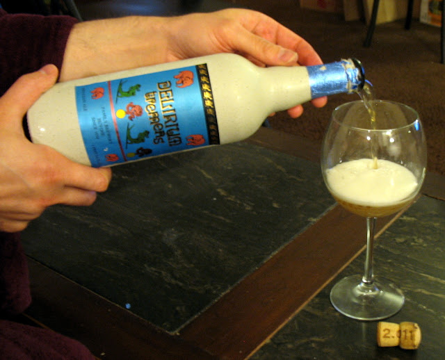 Pouring a bottle of Delirium Tremens Beer