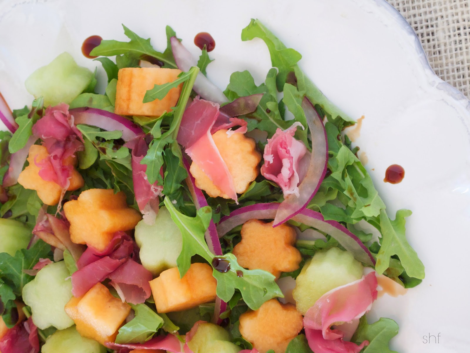 the beauty of sharing Melon and Prosciutto Arugula Salad with