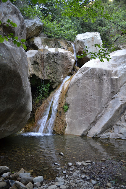 waterfall with rocks surrounding that look like they have been sliced