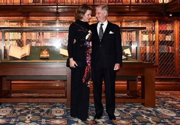 Queen Mathilde wore a floral-print crepe maxi dress by Dries van Noten. King Philippe and Queen Mathilde attended the briefing