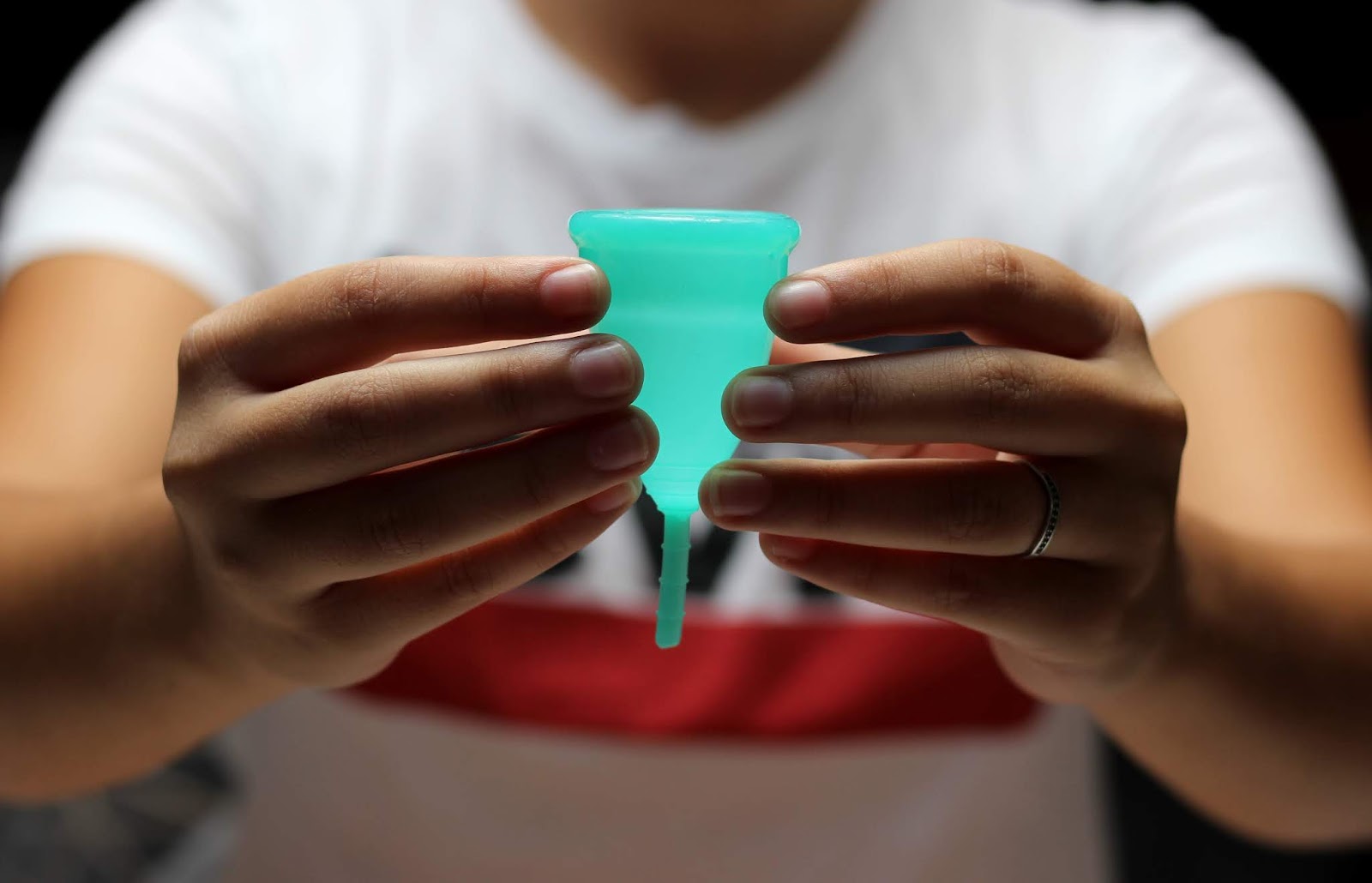 me holding my menstrual cup see the full review