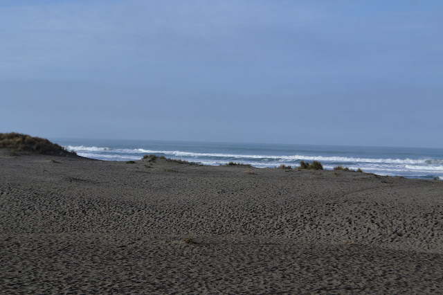 much stomped sand and waves crashing