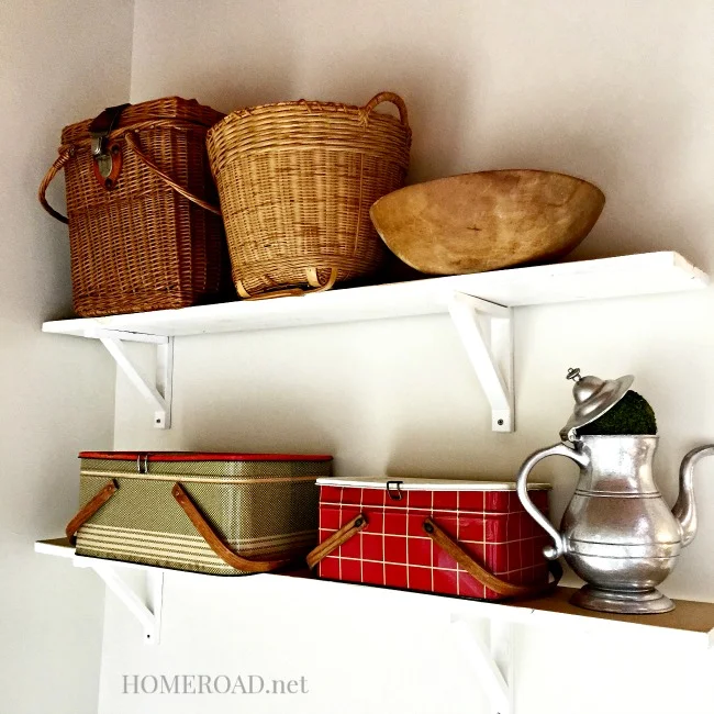 Baskets and lunchbox collection on shelves
