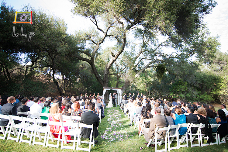 Under a huge tree in the vast backyard was the perfect location for this couple to wed.