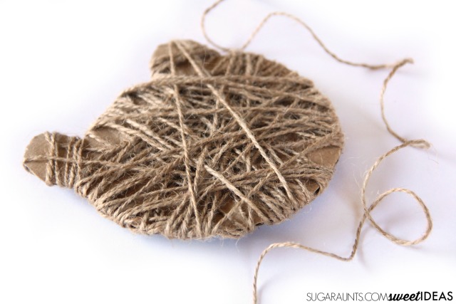 Help kids work on fine motor skills with a bear craft that is perfect for a Christmas ornament.