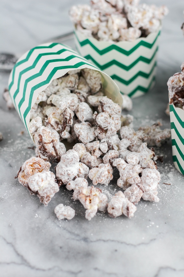 This decadent sweet and salty treat is made by coating popcorn in melted peanut butter and dark chocolate, then tossing it lightly in powdered sugar. Puppy Chow Popcorn is a family favorite snack that's perfect for movie night or watching the big game!