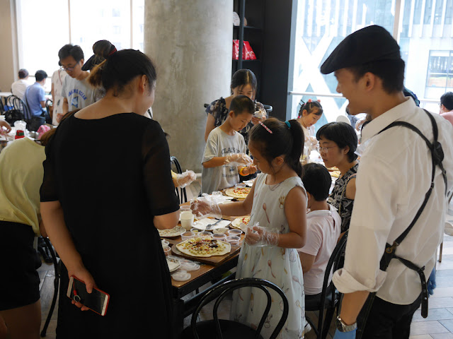 children making pizzas at The Pizza Factory in Guangzhou