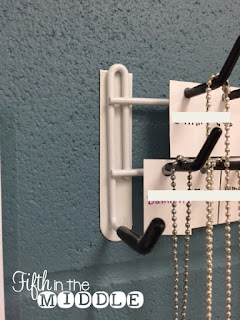 A Closetmaid belt and tie rack attached to the wall with Command strips makes a perfect storage solution.