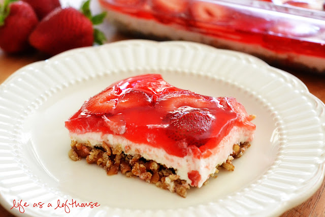 This delicious Strawberry Pretzel Salad is a dessert salad with a pretzel crust, a cream cheese filling topped with fresh strawberries and jello. Life-in-the-Lofthouse.com