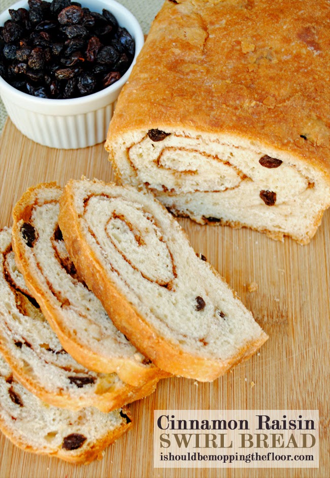 This Cinnamon Raisin Swirl Bread is filled with delicious buttery ribbons of cinnamon, sugar and California Raisins. | Makes three large loaves: perfect for freezing and gifting.
