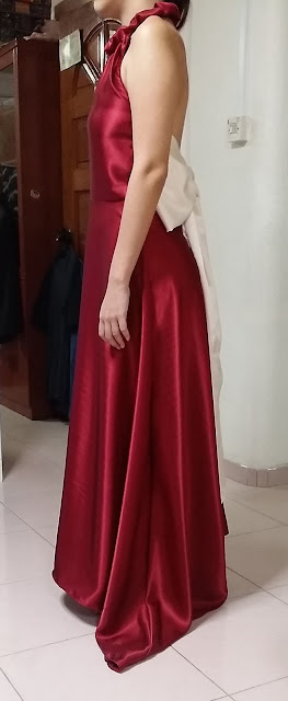 Evening Gown Side View A side view of the self sewn evening gown in wine red and huge off white ribbon bow