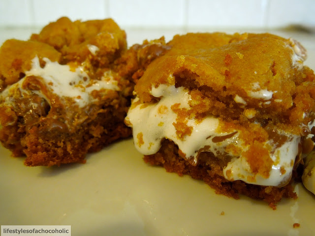 two smores bars on a white plate