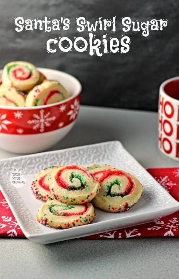Santa's Swirl Sugar Cookies | by Renee's Kitchen Adventures - Easy holiday cookie recipe that transforms sugar cookies into a festive sweet treat with red and green colored sugars!