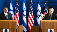 Israel's Defense Minister Ehud Barak (R) gestures as he speaks during a joint news conference with US Secretary of Defense Leon Panetta